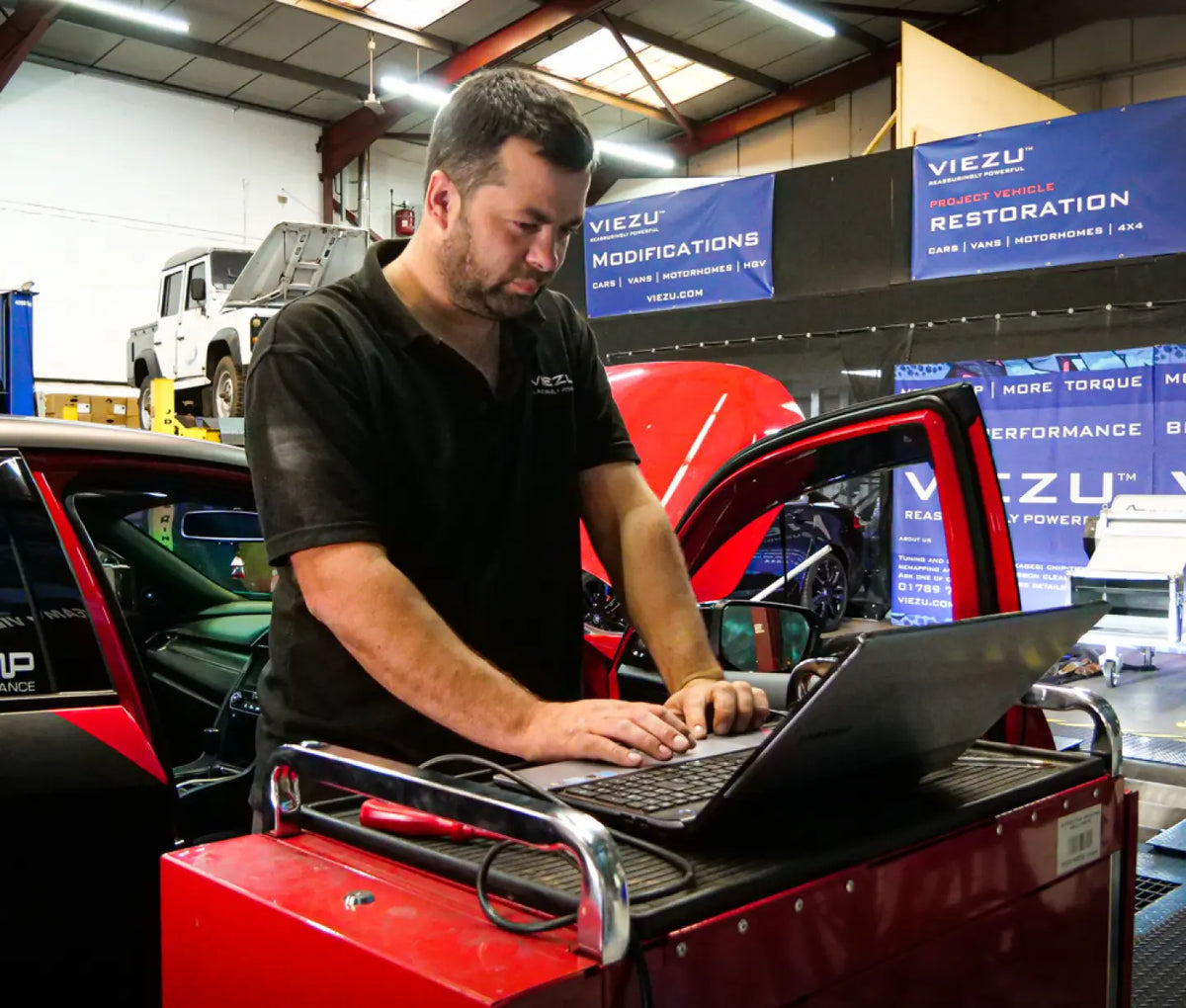Remap File in action, Viezu employee working on a laptop – Viezu USA