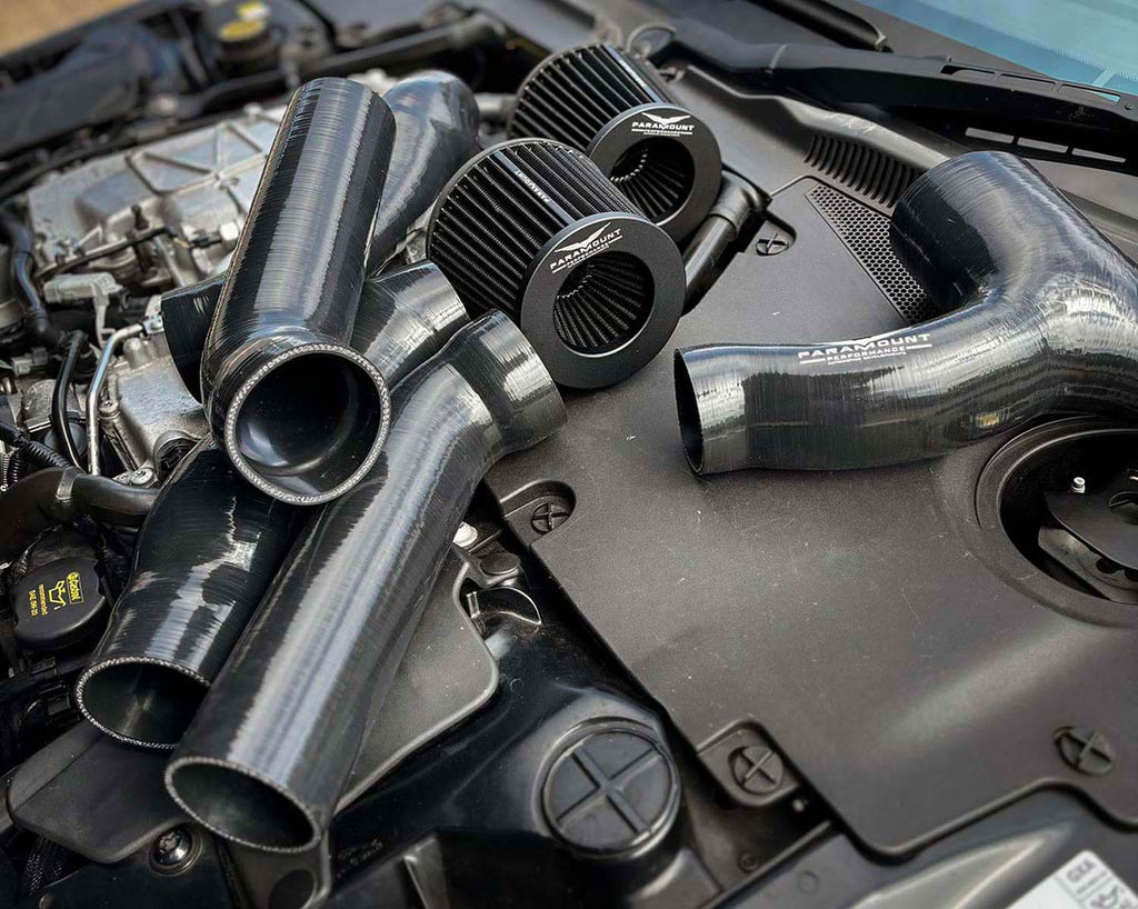 Jaguar F-Type cold air induction kit silicone pipework and filters laid out in engine bay