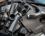 Jaguar F-Type cold air induction kit silicone pipework and filters laid out in engine bay