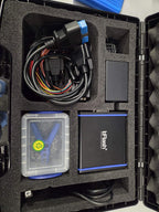 Top view of bFlash ECU programming kit with interface module, cables, power supply and probe box in foam case